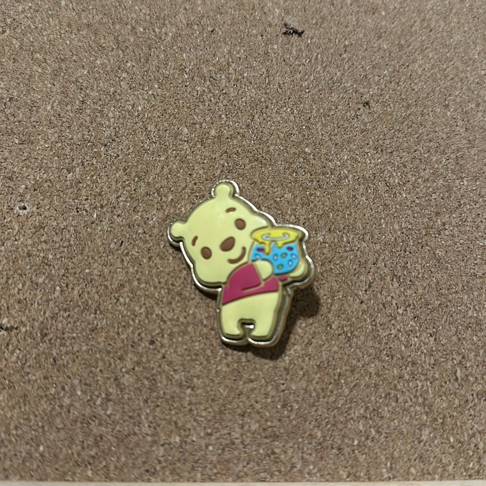 Winnie the Pooh holding honey blind box pin